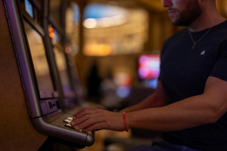 Man Playing Slot Machine